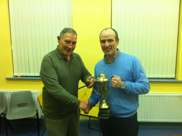 Eamon Kennedy is presented with the trophy for heaviest fish for 2011